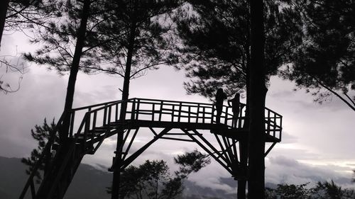 Silhouette trees against sky