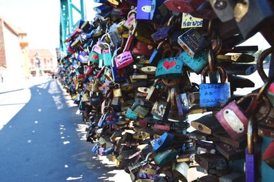 Close-up of padlocks hanging on railing