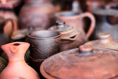 Close-up of antique containers at market stall