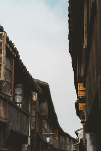 Buildings in city against sky