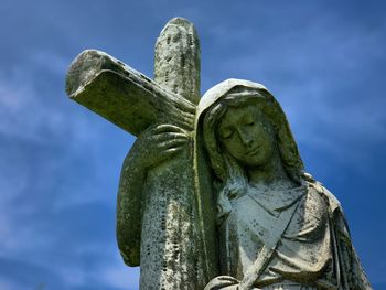 Low angle view of statue against sky