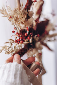 Close-up of hand holding christmas decoration