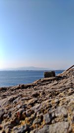 Scenic view of sea against clear blue sky