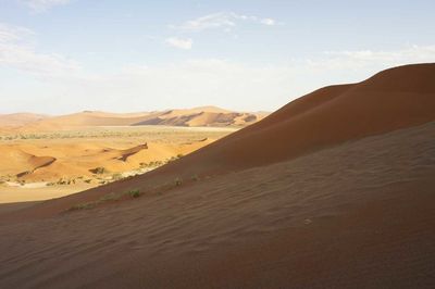 View of desert landscape against sky