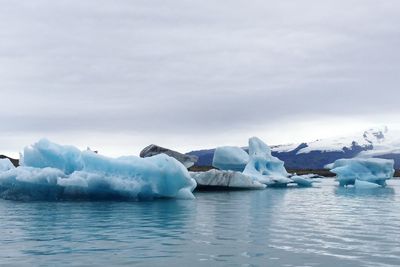 Scenic view of frozen lake against sky