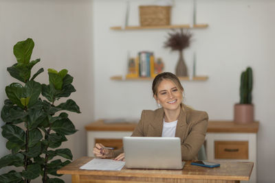 Woman working at home with laptop. home office.  notebook for working. 