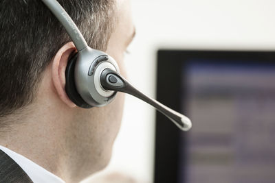 Close-up of businessman wearing headphones