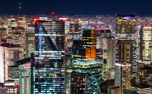 High angle view of illuminated cityscape at night