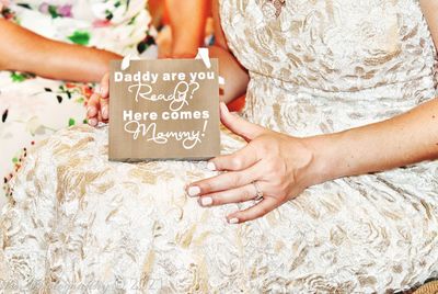 Midsection of woman holding hands