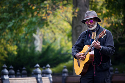 Man playing guitar outdoors