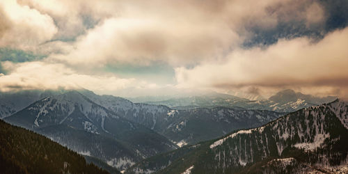 Scenic view of snowcapped mountains against sky