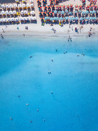 High angle view of people at beach on sunny day