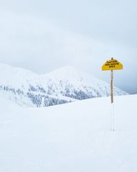 Scenic view of snow covered mountain against sky