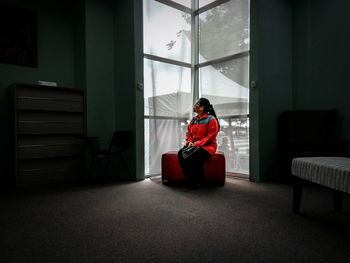 Man sitting on sofa at home