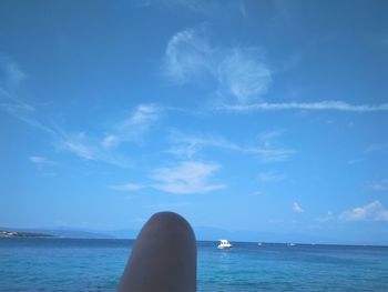 Scenic view of sea against blue sky