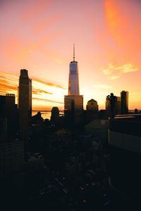 Silhouette of city at sunset