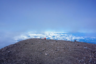 People on beach against sky