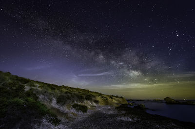 Scenic view of star field against sky at night