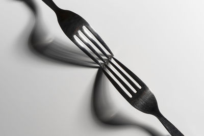 Close-up of forks against white background