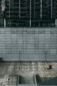 High angle view of parking lot and building in city