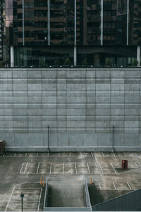 High angle view of parking lot and building in city