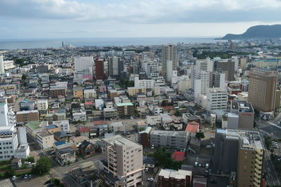 High angle view of buildings in city against sky