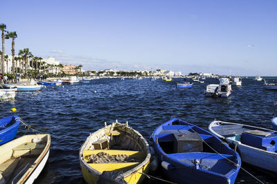 High angle view of boats moored in sea against clear sky