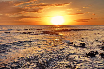 Scenic view of sea against sky during sunset