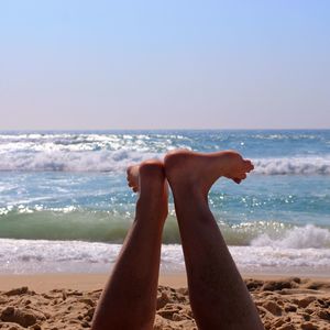 Low section of person on beach