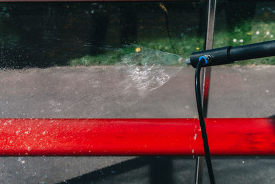 Close-up of wet bicycle during rainy season