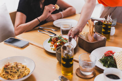 Midsection of man preparing food on table