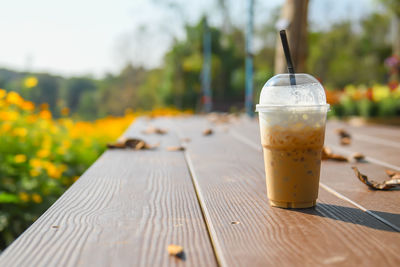 Close-up of drink in disposable cup on table