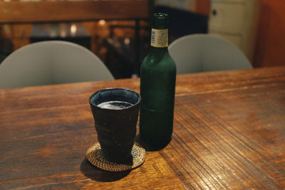 Close-up of beer bottle on table at restaurant