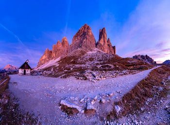 Scenic view of rocky mountain against sky during winter