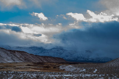 Scenic view of snowcapped mountains against sky