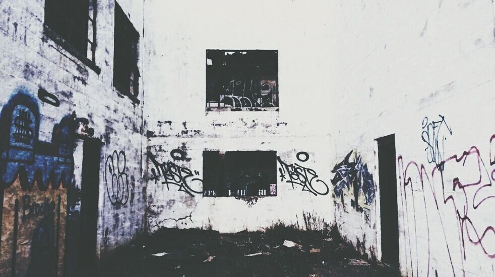 architecture, built structure, graffiti, building exterior, wall - building feature, text, western script, building, wall, abandoned, communication, window, damaged, weathered, old, day, obsolete, run-down, deterioration, no people