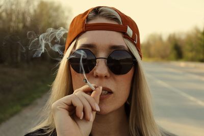 Close-up of young woman wearing sunglasses