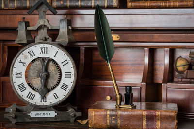 Close-up of clock on table