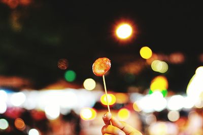 Defocused image of illuminated lights at night