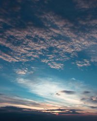 Scenic view of cloudy sky at sunset