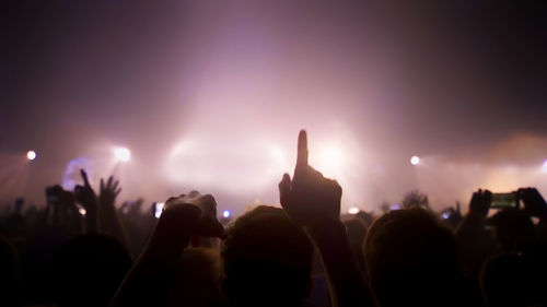 Silhouette people at music concert