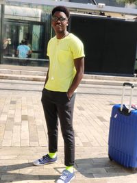 Full length portrait of young man standing outdoors