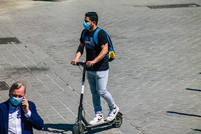 High angle view of man standing on street