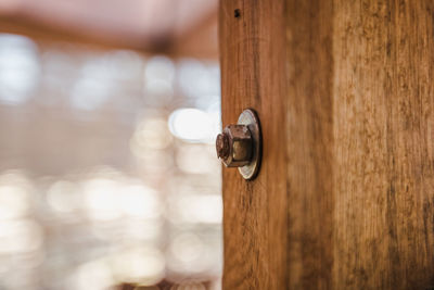 Close-up of door handle on wall