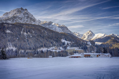 Scenic view of snowcapped mountains against sky during winter