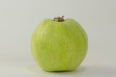 Close-up of apple against white background