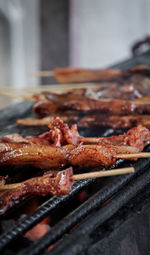 Close-up of meat on barbecue grill