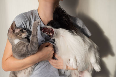 Portrait of woman holding cat