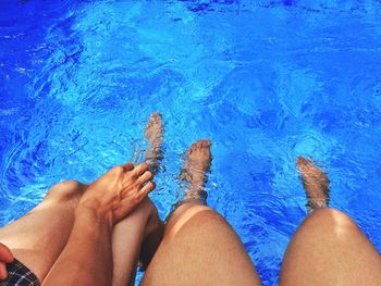 Low section of woman in swimming pool