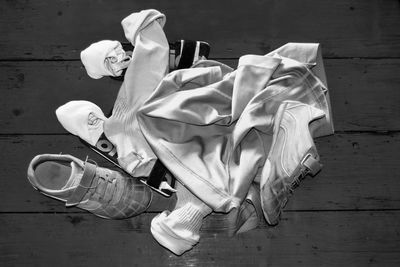 Directly above shot of soccer uniform and shoes on table